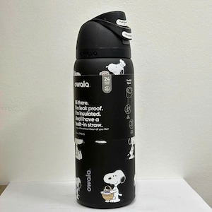 May include: Black Owala water bottle with a Snoopy design. The bottle has a push-button lid and a built-in straw. The bottle is insulated and leak-proof. It holds 24 oz / 710 mL of liquid.