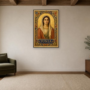 May include: A rectangular framed wall art print featuring a portrait of a person with a head covering, wearing a red and green garment. The image is surrounded by an ornate gold, blue, and red floral border with the name JUNIA printed at the bottom.