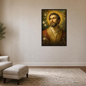 May include: A framed rectangular wall art print featuring a portrait of Saint Augustine of Hippo. The figure has a beard, a golden halo, and wears ornate red and gold robes. The background shows white flowers and foliage. The text reads Saint Augustine of Hippo.
