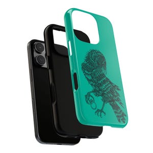 May include: A teal phone case featuring a black bird design. The case is layered over a black phone and a black inner case. The bird illustration is detailed with fine lines and is perched on a branch.