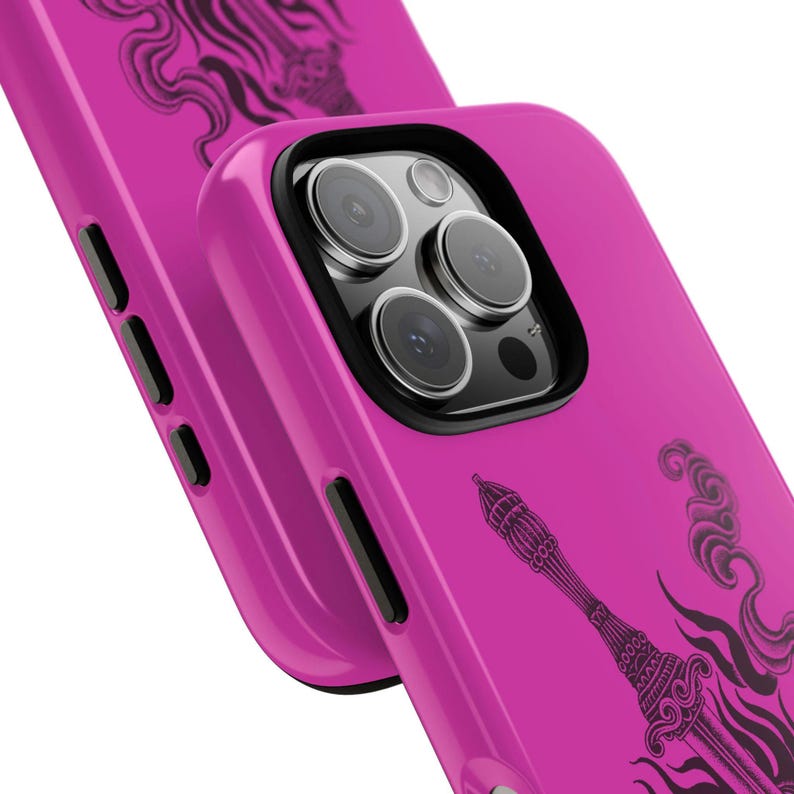 May include: Bright pink phone case with a black decorative design. The case has a black camera lens protector and black side buttons. The design appears to be a stylized illustration of a tower and smoke.