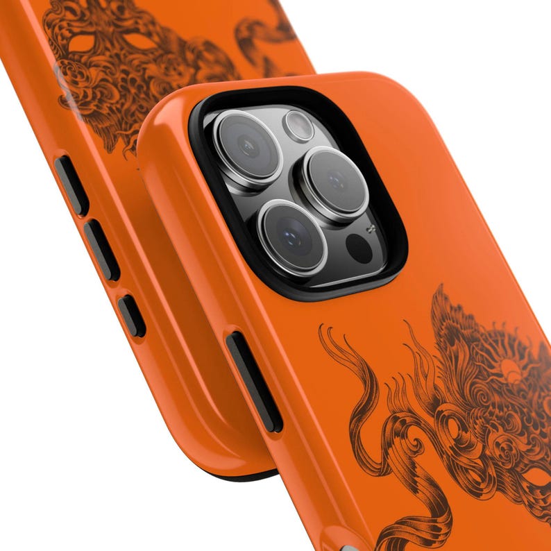 May include: Orange phone case with a black dragon design. The case has a glossy finish and features a camera cutout. The dragon design is detailed and covers a portion of the case.