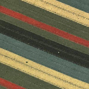 May include: Close-up of a fabric with diagonal stripes in various colors. The stripes include shades of green, blue, red, and beige. The fabric has a textured appearance.