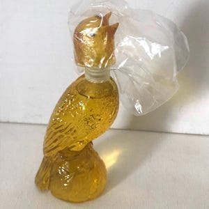 Fragrância colecionável vintage Avon • Frasco cheio de pássaro de vidro amarelo Golden Notes • Colônia Avon Golden Notes Moon Wind • Frasco colecionável