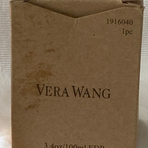 May include: A brown cardboard box with the text "Vera Wang" and "3.4oz/100ml EDP Spray Tester" printed on it. The box has a barcode and the number "1916040 1pc" printed on it.