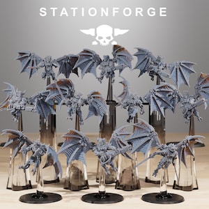 May include: A group of miniature figurines with bat-like wings, in a flying pose. The figures are mainly grey with bronze details, mounted on clear stands. The text "STATIONFORGE" and a skull logo are visible at the top of the image.