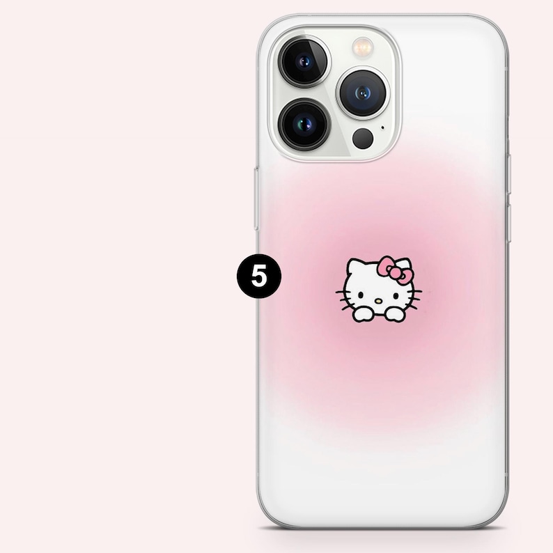 Puede incluir: Funda transparente para tel&eacute;fono con un dise&ntilde;o degradado rosa y un gr&aacute;fico de Hello Kitty. La funda tiene un acabado brillante y est&aacute; dise&ntilde;ada para un smartphone. El gr&aacute;fico de Hello Kitty est&aacute; centrado en la parte posterior de la funda.