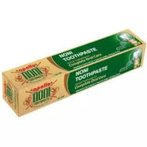 May include: A rectangular box of Apollo Noni Toothpaste featuring a tan and dark green colour scheme. The packaging displays the text Noni Toothpaste, Herbal Toothpaste for Complete Oral Care, and includes illustrations of noni fruit and leaves.