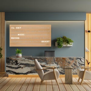 May include: Interior design featuring a reception area with a marble countertop, two armchairs, and a small table. A wooden floor and walls complement the space, with a message board displaying text. Plants and a floor lamp add to the decor.