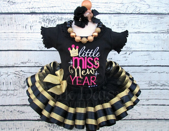 black and gold pink outfit