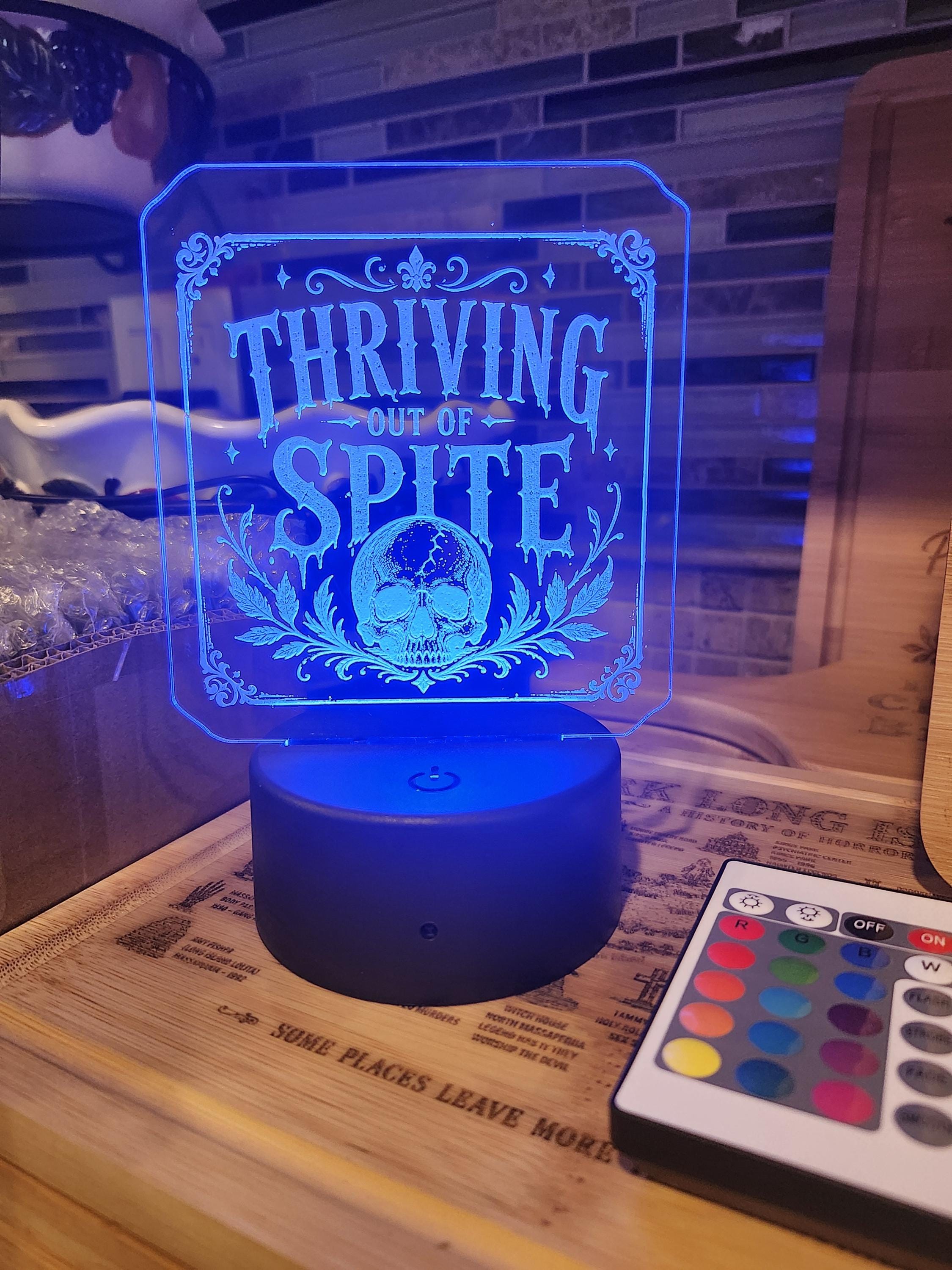 LED acrylic edge-lit sign glowing on a shelf