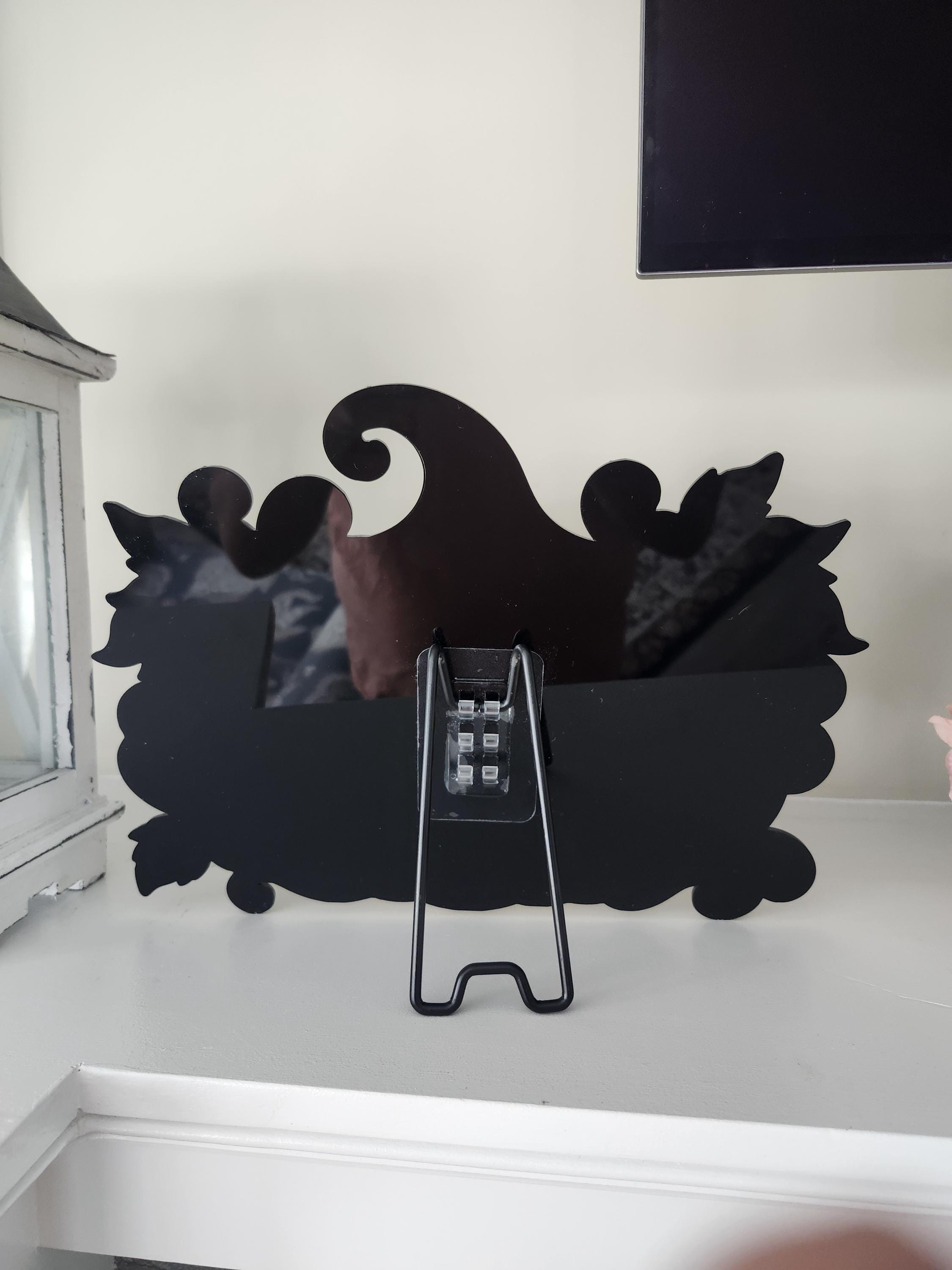 Mirrored acrylic Jack O Lantern — wood grain and finish detail of the laser engraved gothic piece