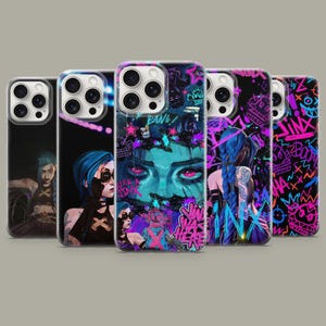 May include: Five phone cases showcasing colourful artwork of a character with blue hair. The designs include portraits, graffiti, and the word "Jinx" in bold lettering, set against a black background.