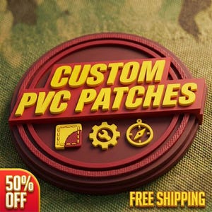 May include: A circular maroon PVC patch featuring the yellow text CUSTOM PVC PATCHES across a rectangular bar. Below the text are three yellow icons: a square with a stitched corner, a gear with a wrench, and a compass. The design is raised.