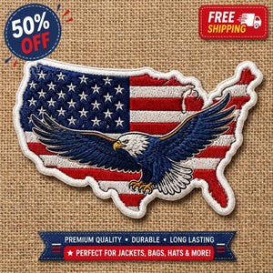 May include: An embroidered patch shaped like the map of the United States, featuring a red, white, and blue flag pattern with a central bald eagle in flight. The eagle has dark blue wings, a white head, and yellow talons, set against the stars and stripes.