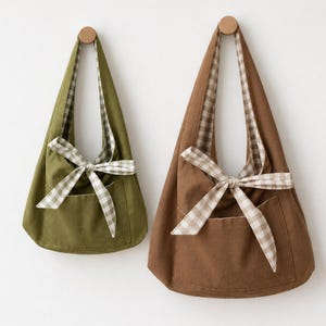 Wendbare Hobo-Tasche in 2 Größen mit Schleifen und Taschen: Schnittmuster, Anleitung und Video-Tutorial. Lässige Schultertasche, Tragetasche.