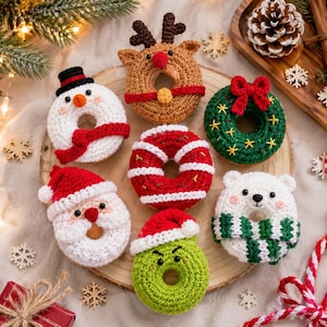 May include: A collection of seven crocheted donut ornaments featuring holiday themes including a snowman, a reindeer, a Christmas wreath, a red and white striped donut, a Santa Claus, a green character with a hat, and a white polar bear.