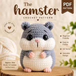 May include: A crocheted hamster toy in gray and white, with black eyes and pink accents. The text "The hamster CROCHET PATTERN" is displayed above the toy. The approximate size is 3.1 inches (8 cm) without ears.