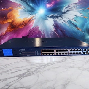 May include: A dark blue network switch with multiple ports and a small blue display. The device is labelled "PLANET" and has various indicator lights. The background features a colourful, abstract design with a bright central light.