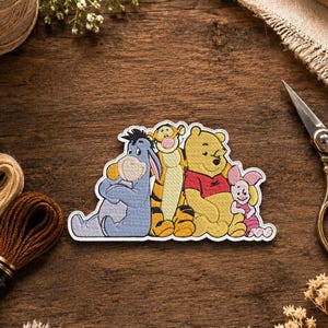 May include: An embroidered patch featuring a group of four cartoon characters: a blue donkey, an orange and black striped tiger, a yellow bear wearing a red shirt, and a small pink piglet, all sitting together in a row with a white border.