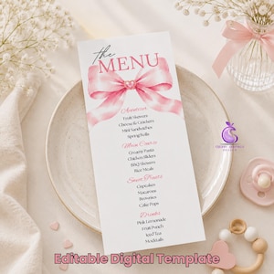 May include: A vertical menu card featuring a large pink watercolor bow with a heart center and the text The MENU. The card lists sections for Appetizer, Main Course, Sweet Treats, and Drinks with various food items printed in black and pink ink.