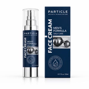 May include: A face cream bottle and box set. The bottle is silver and navy blue with the text "PARTICLE" and "MEN'S FORMULA DAILY CARE". The box is navy blue with the text "FACE CREAM" and "AESTHETIC SCIENCE FOR MEN".