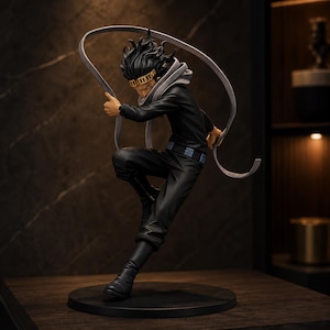 May include: A dynamic anime-style figurine of a character with spiky black hair, wearing a black long-sleeved shirt, black trousers, and tall black boots. The figure features a gold-coloured visor and a long, light grey fabric scarf floating around.