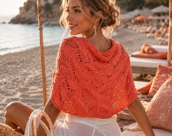 May include: A bright coral orange short-sleeved knit top featuring an intricate openwork pattern and a wide neckline, paired with a white semi-sheer wrap skirt and a woven straw tote bag with tassel details.