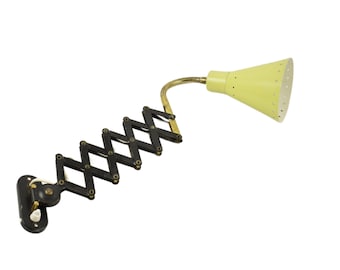 Scissors wall light. Vintage yellow harmonica or scissors wall lamp from the 60s attributed to design firm Hala