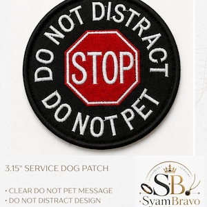 May include: A circular black embroidered patch featuring a red and white stop sign icon in the center. The text DO NOT DISTRACT and DO NOT PET is embroidered in white capital letters around the border of the patch. The patch measures 3.15 inches.