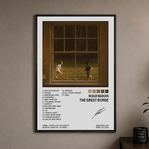 May include: A framed poster featuring the album art for Noah Kahan's "The Great Divide." The artwork shows a window with two figures outside. The poster includes the album's tracklist, artist name, and release information.