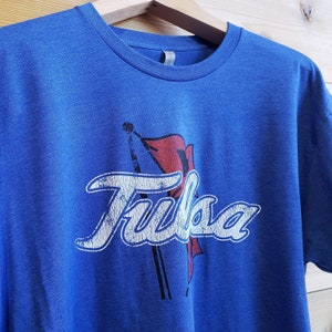 The University of Tulsa Golden Hurricane Primary Logo Unisex T-shirt on Royal Blue