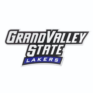 May include: A white sticker with the words "GRAND VALLEY STATE LAKERS" in a stylized font. The text is primarily white with black and blue accents. The sticker has a black border and a blue banner at the bottom.