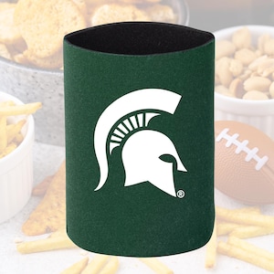 May include: A green can cooler with a white Spartan helmet logo. The cooler is cylindrical with a black interior and is designed to keep beverages cold. Perfect for tailgating or game day.