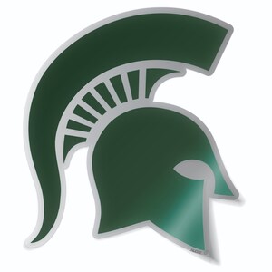 Puede incluir: Pegatina de casco espartano verde y plateado. El casco es una vista de perfil con una pluma en la parte superior. La pegatina tiene un respaldo despegable.