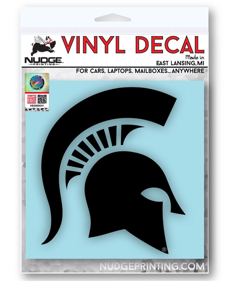 Puede incluir: Calcoman&iacute;a de vinilo negro de un casco espartano, con las palabras "VINYL DECAL" y "NUDGE. -PRINTING- Made in EAST LANSING.MI FOR CARS, LAPTOPS, MAILBOXES... ANYWHERE" arriba y "NUDGEPRINTING.COM" abajo.