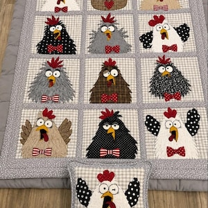 May include: A handmade quilt and pillow set featuring whimsical chicken designs. The quilt showcases various chicken characters with red bow ties and crests, set against a checkered background. The pillow mirrors the chicken theme, adding a playful touch to the bedding.