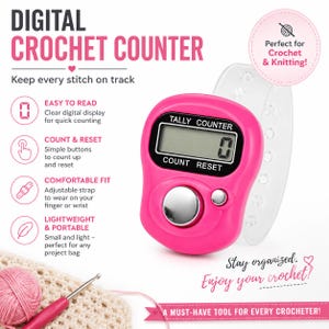 May include: A bright pink digital tally counter with a clear LCD screen, a large silver count button, and a smaller silver reset button. The device features an adjustable, translucent silicone strap designed to be worn on a finger or wrist.