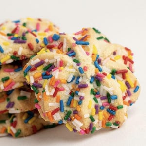 ~Italian Rainbow Spritz Cookies~ 
Delicately handcrafted Italian butter spritz cookies with a rich, buttery crumb and tender melt-in-your-mouth texture. Each cookie is finished with a vibrant coating of colorful sprinkles for a festive, elegant touch that balances nostalgic charm with gourmet refinement. Perfectly light, subtly sweet, and beautifully finished for gifting or entertaining.
Approximately 25 cookies per pound, made in small batches.