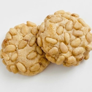 ~Pignoli Cookies~ 
Soft, bakery-style Pignoli Cookies ~a cherished Italian classic~ made with rich almond paste for a naturally sweet, chewy center and generously coated with golden, toasted pine nuts. Each bite is soft, nutty, and delicately crisp on the outside, delivering an indulgent, authentic bakery experience. Each pound includes approximately 36 cookies, making them perfect for gifting, holiday trays, or an elegant everyday treat.