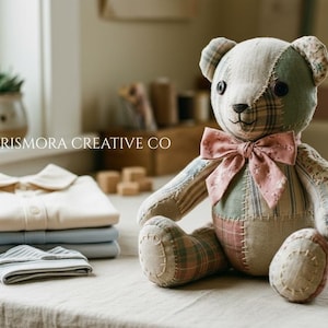 May include: A patchwork teddy bear made of various fabric patterns in muted green, pink, and beige tones, featuring dark button eyes, a stitched nose, and a pink floral bow. Beside it sits a stack of folded light-colored clothing and the text PRISMORA CREATIVE CO.