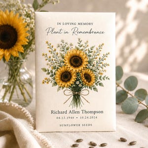 May include: A rectangular cream-colored paper packet featuring a watercolor illustration of a sunflower bouquet tied with twine. Text reads: IN LOVING MEMORY, Plant in Remembrance, Richard Allen Thompson, 04.12.1948 - 10.24.2024, SUNFLOWER SEEDS.