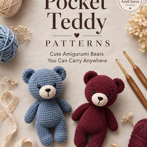 May include: A pattern book titled Pocket Teddy Patterns featuring two crocheted amigurumi bears in blue and burgundy, two crochet hooks labeled 2.0 mm and 2.5 mm, yarn balls, lace ribbon, and dried flowers on a light fabric background.