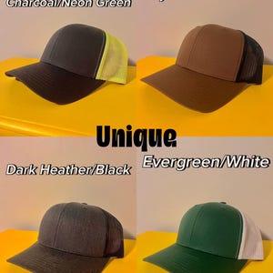 May include: Four trucker hats displayed in a grid. Top left: Charcoal/Neon Green. Top right: Coyote Brown/Black. Bottom left: Dark Heather/Black. Bottom right: Evergreen/White. Each hat features a solid front panel, a curved brim, and a mesh back.