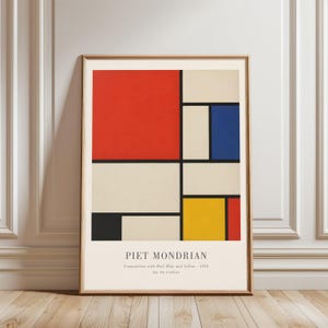 May include: A framed art print of Piet Mondrian's "Composition with Red, Blue and Yellow - 1938." The artwork displays a geometric composition with blocks of red, blue, yellow, and black on a cream background. The print is presented in a wooden frame.
