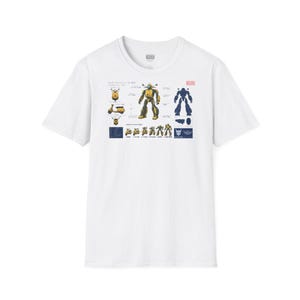 May include: A white short-sleeve t-shirt featuring a graphic print on the chest. The design displays technical schematics of a yellow scooter transforming into a yellow robot, including various views, transformation steps, and blue text labels.