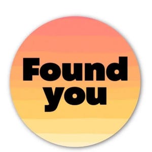 May include: A circular sticker featuring a gradient background in shades of orange and yellow. The words "Found You" are printed in bold, black text. Suitable for personalising items or as a decorative element.