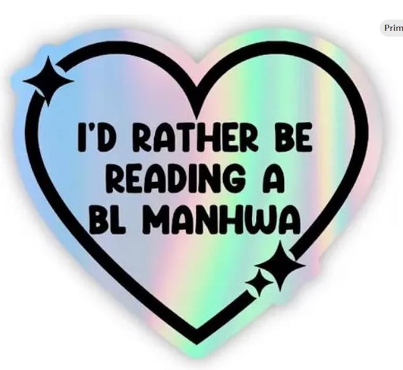 May include: Holographic heart-shaped sticker with a black outline and the text "I'D RATHER BE READING A BL MANHWA". The sticker has a rainbow iridescent effect and two black starburst accents.