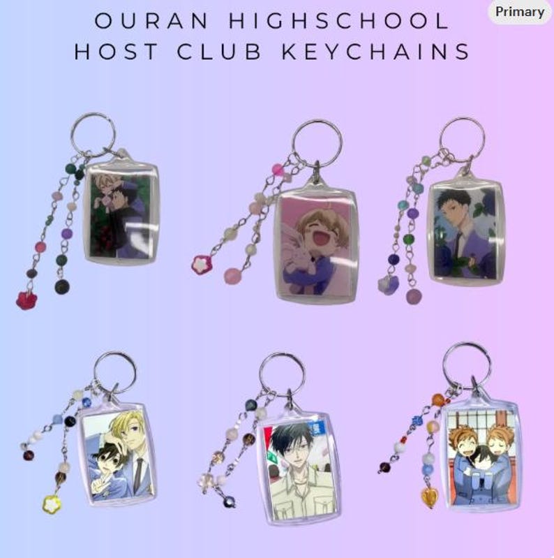 May include: Rectangular keychains featuring anime characters from Ouran Highschool Host Club. Each keychain has a silver ring and a beaded charm. The keychains display different characters in various poses. The text "OURAN HIGHSCHOOL HOST CLUB KEYCHAINS" is at the top.