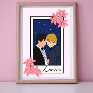 May include: Framed art print featuring a stylized illustration of two people in formal wear, their heads touching, set against a starry night sky. Pink lilies adorn the frame, with the word "Lovers" at the bottom.